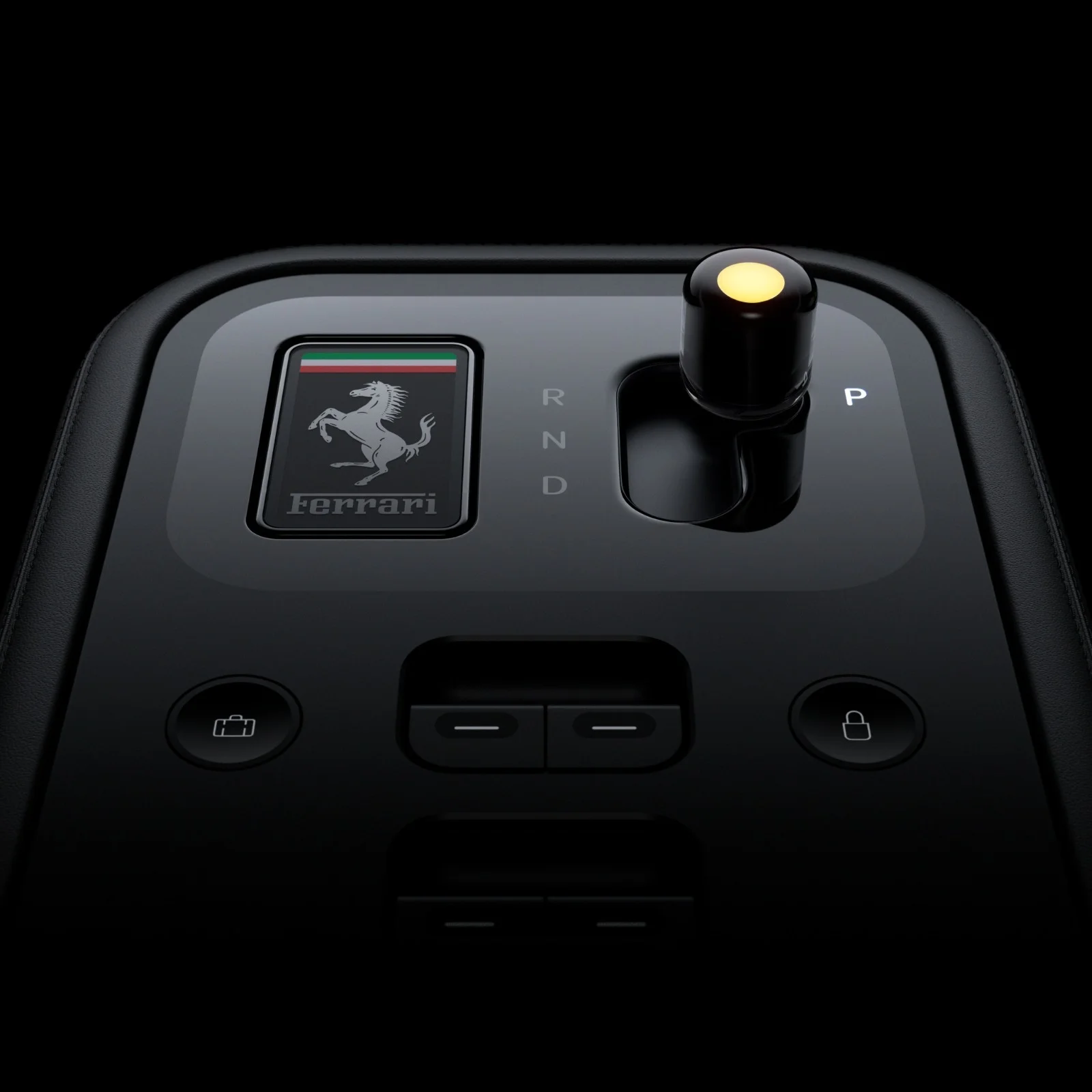 Detail of the Ferrari Luce gear selector with Ferrari badge, joystick-type lever with yellow light on the tip, and trunk and lock buttons