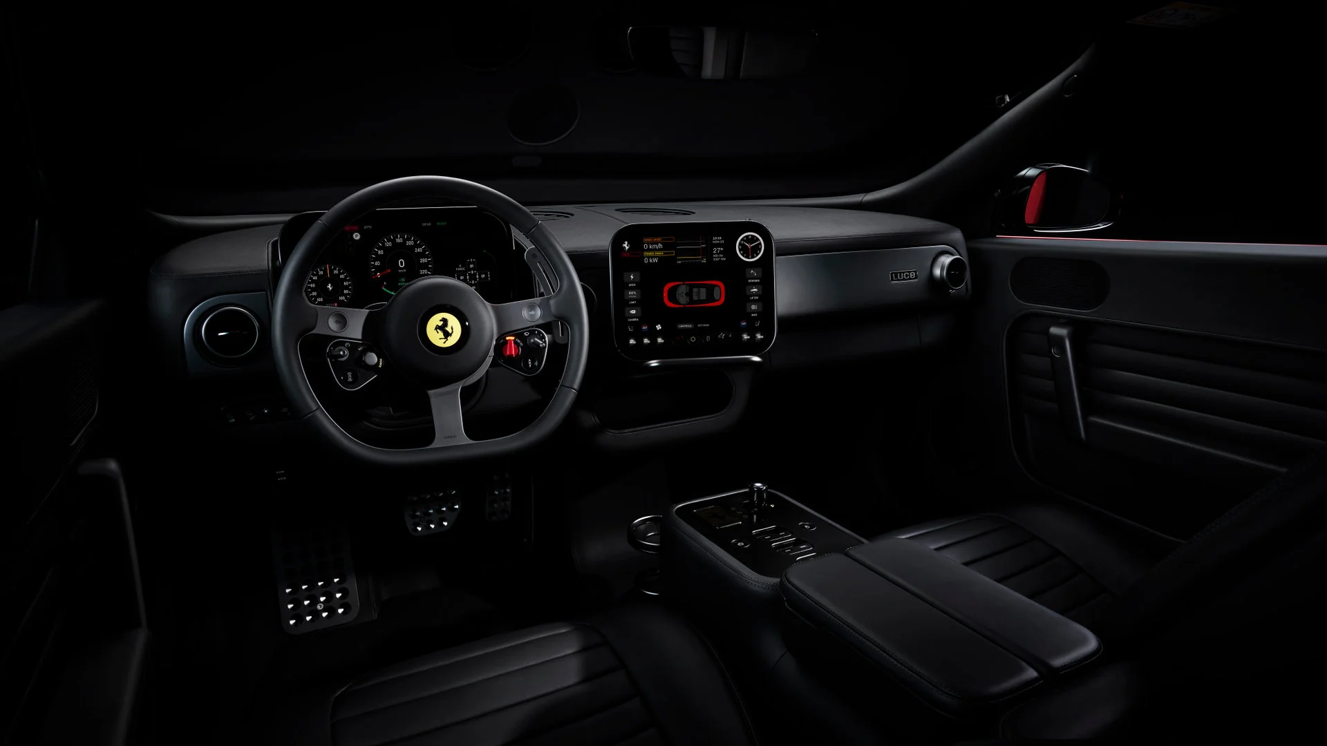 Interior of the Ferrari Luce in total black configuration, showing steering wheel, dashboard with digital cluster, central illuminated screen, and central console with gear lever