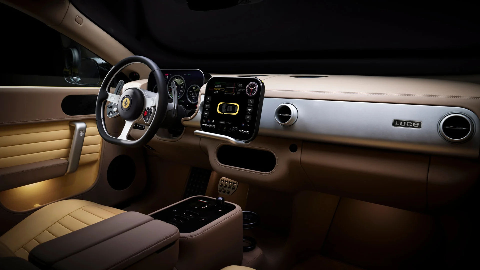 Complete interior of the Ferrari Luce in tan beige with gold details, showing the steering wheel, instrument cluster, central screen, and LUCE inscription on the dashboard