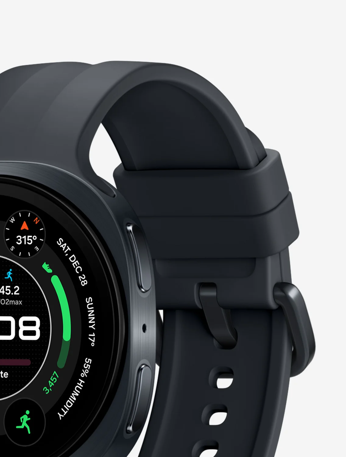 El Galaxy Watch 9 en gris oscuro con correa deportiva de silicona negra, visto de perfil