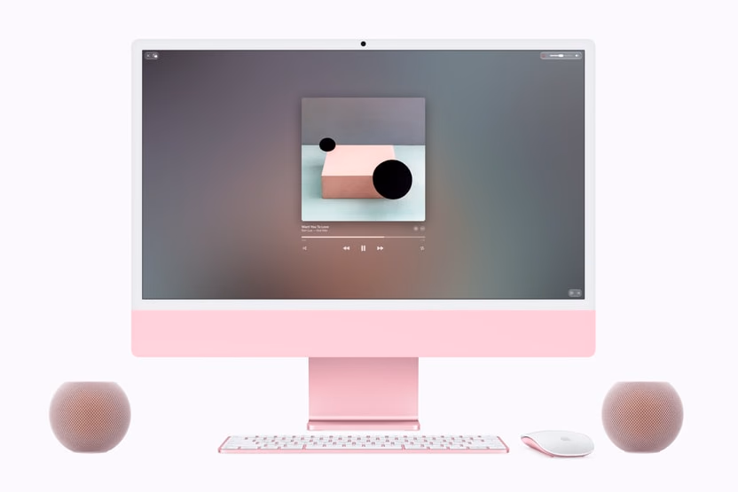 Pink iMac accompanied by two HomePod mini 2 speakers