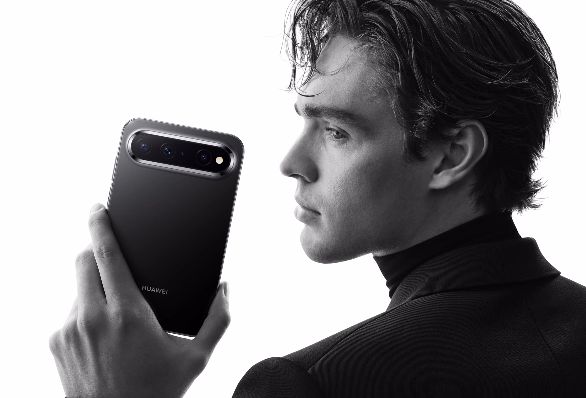 Side-profile model with the Pura X View in black, showing the smooth back cover and horizontal module