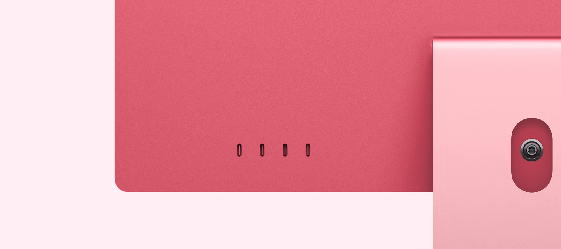 Detail of four rear ports on a pink iMac