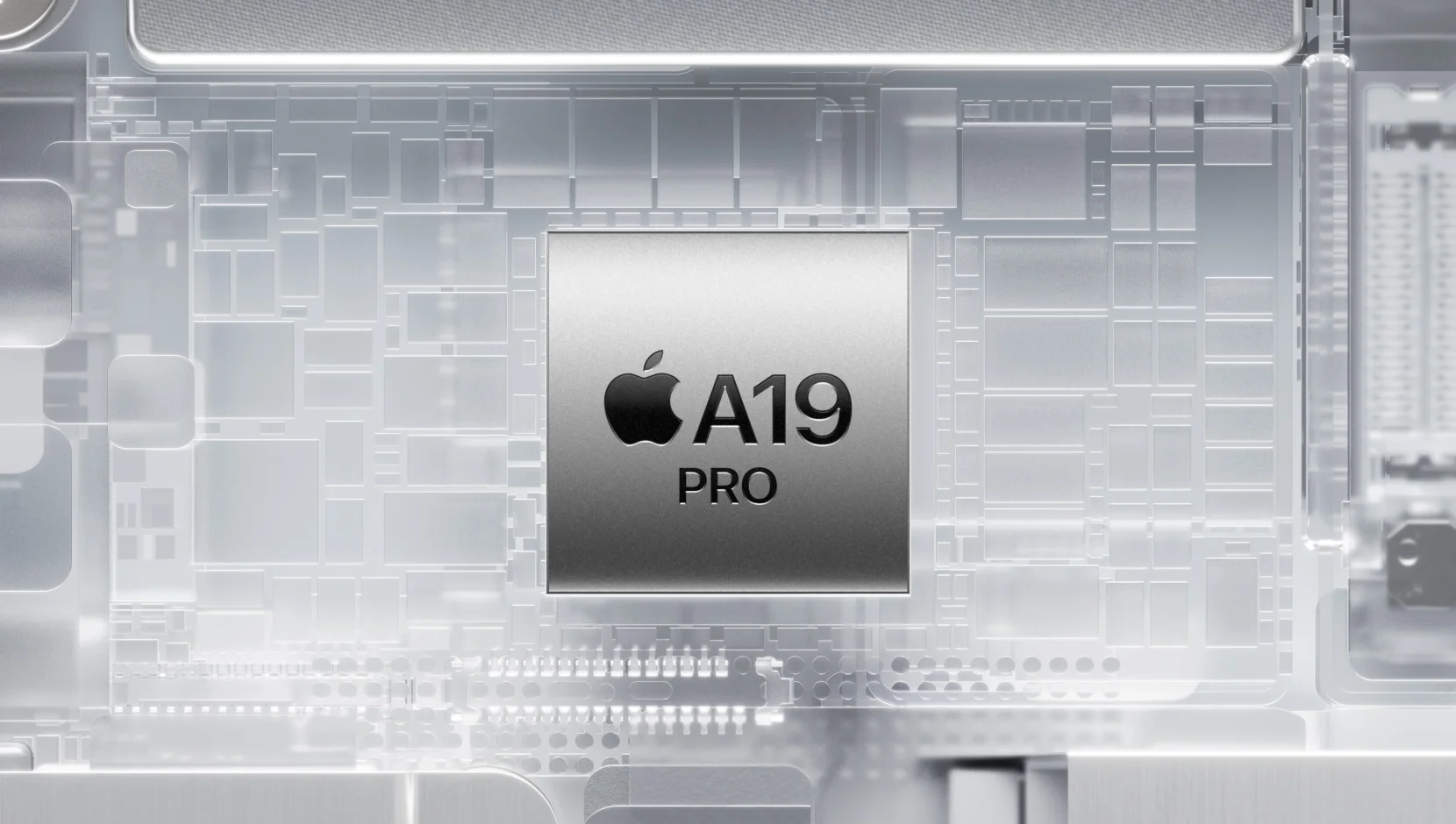 Close-up of Apple’s "A19 PRO" chip in a metallic tone, placed over a background illustrating a translucent, silver, glossy circuit board.