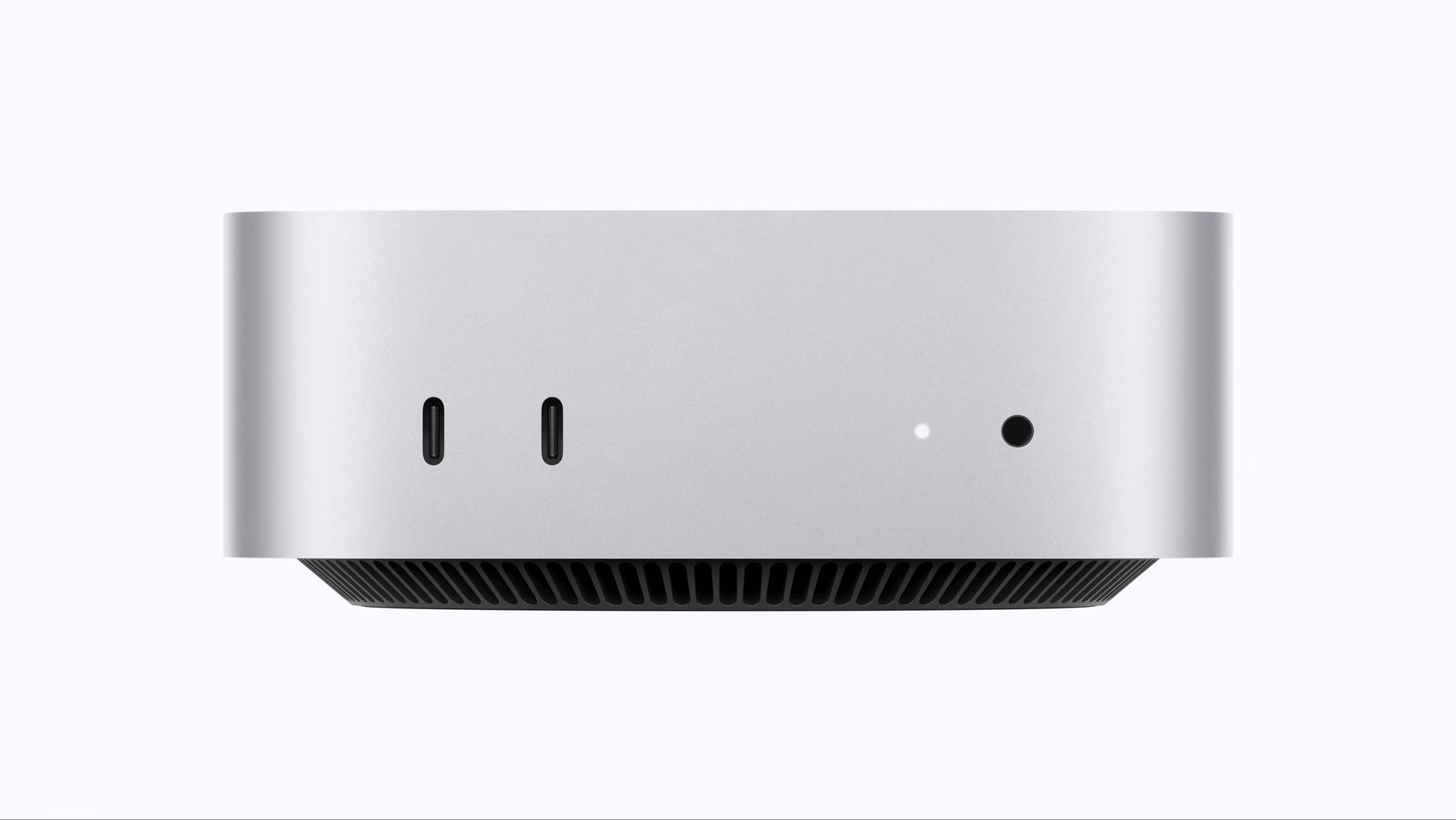 Vista frontal del Mac mini con dos puertos USB-C, el indicador de encendido y el jack de auriculares