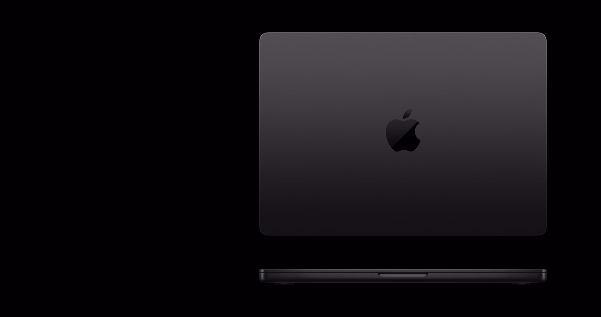 Space Black MacBook Pro viewed from above and in profile