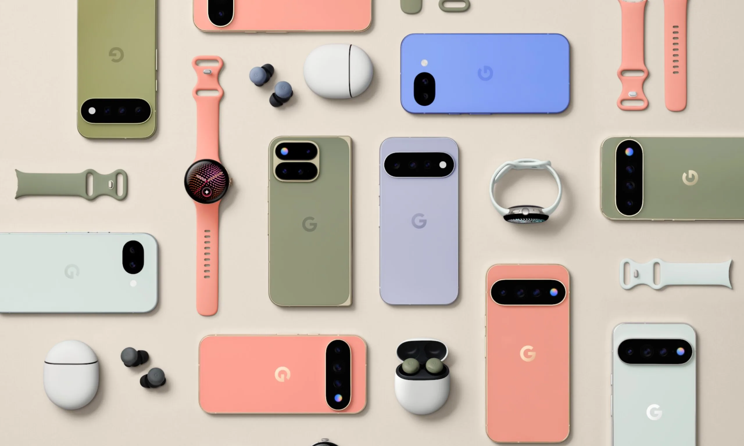 Vista cenital de la línea completa de Google: teléfonos en verde, coral, lavanda y menta junto a auriculares, un reloj y correas