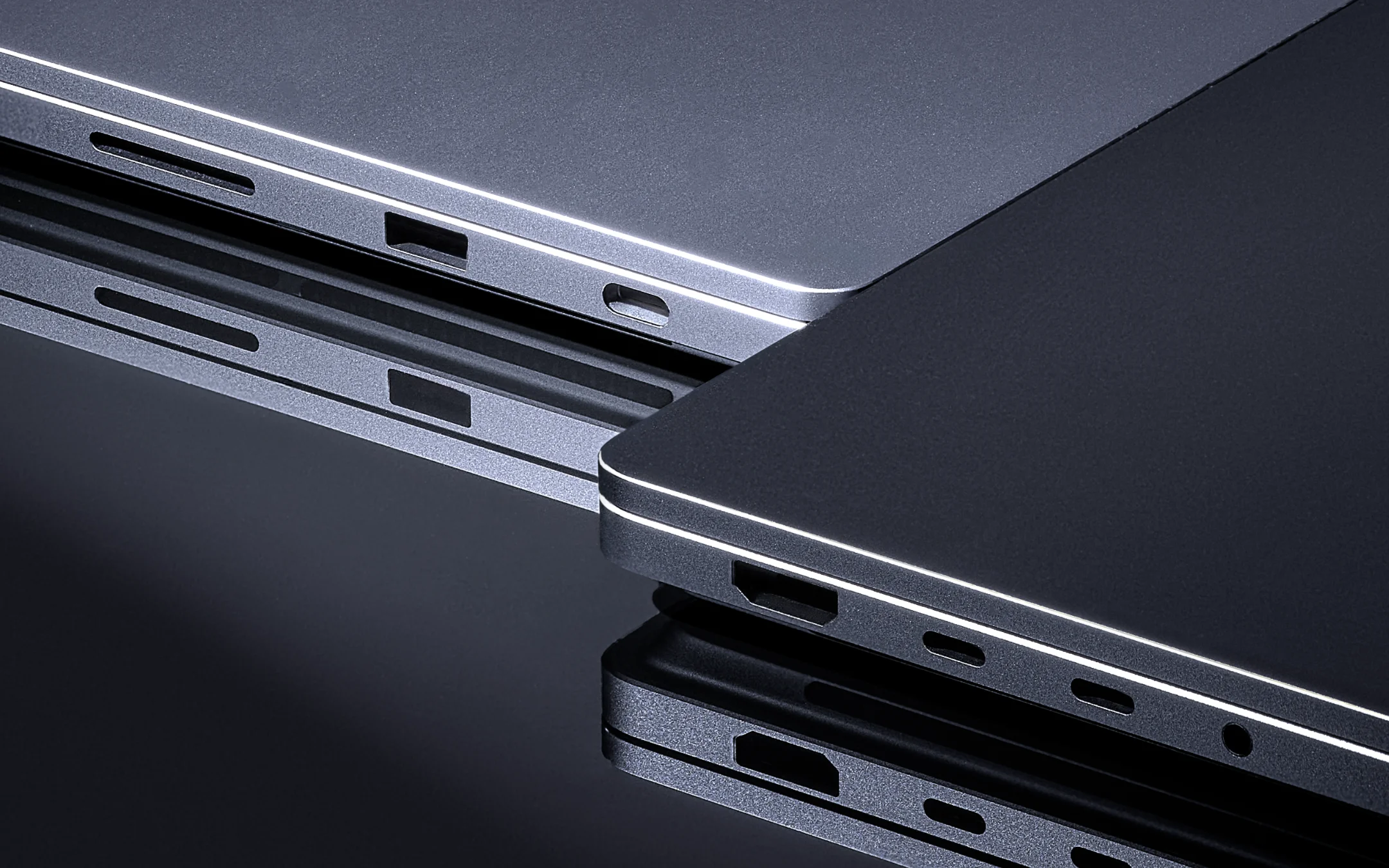 Close-up of the ports on stacked Surface Laptop Ultras with beveled aluminum edges