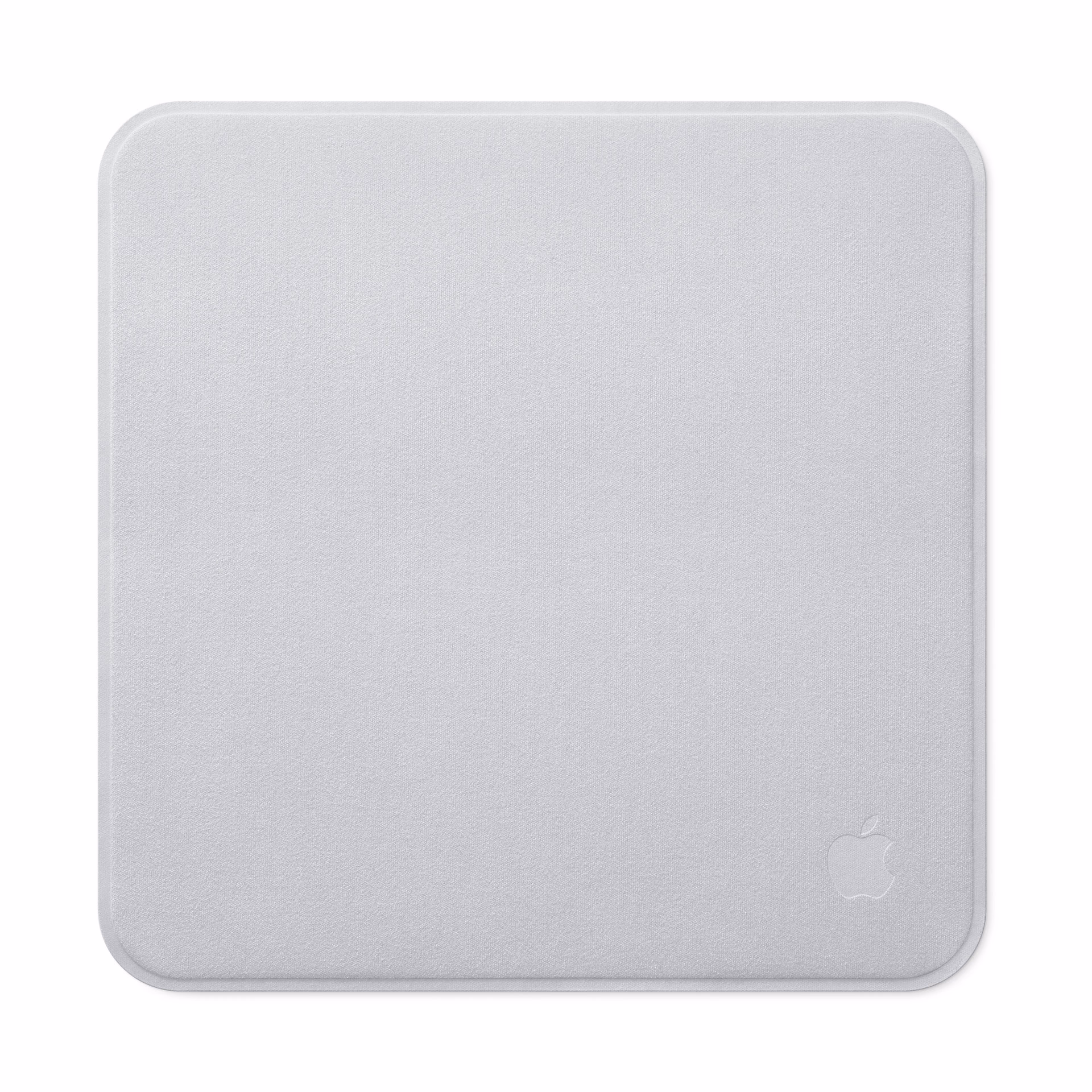 Apple's new polishing cloth, square and light-colored, with the logo etched in one corner