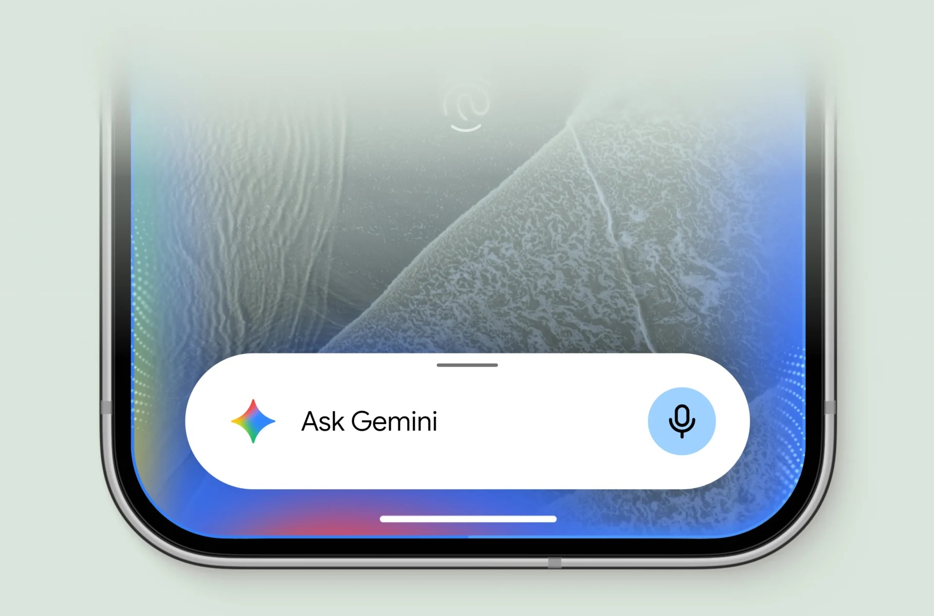 La barra de Gemini abierta en la parte inferior de la pantalla de un Pixel 11, con el ícono del micrófono