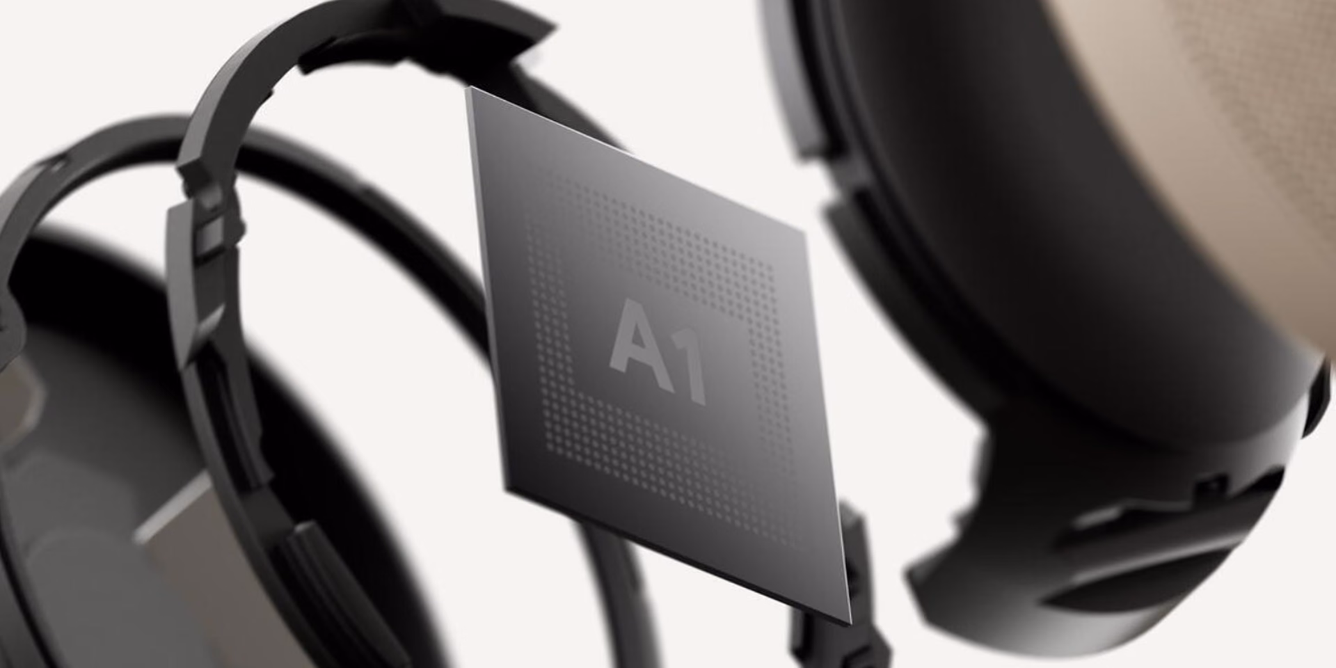 El chip Tensor A1 de Google flotando en primer plano frente a un par de Pixel Buds Pro 2 negros