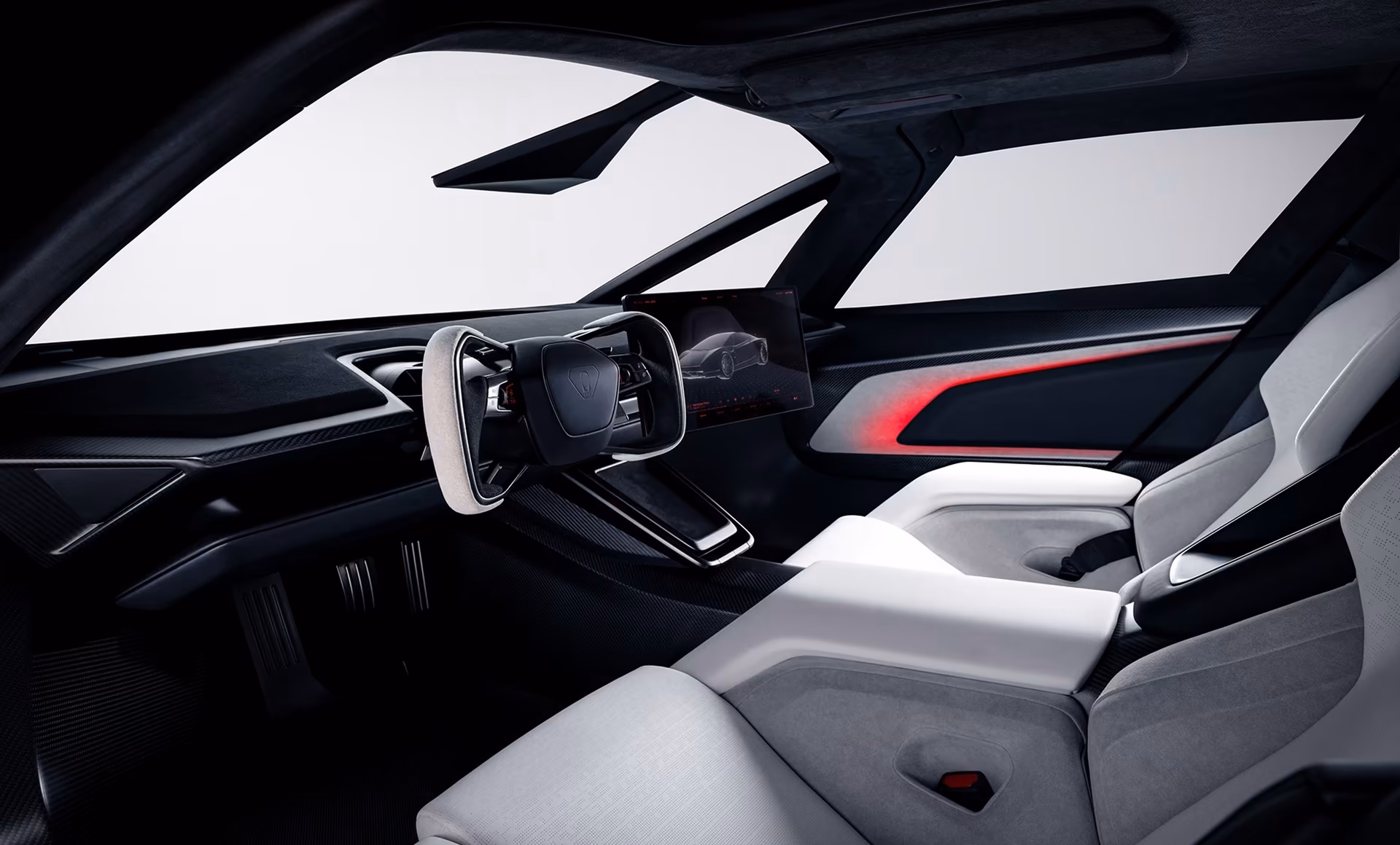 Two-seat cabin of the Tesla Roadster with screen and yoke steering wheel