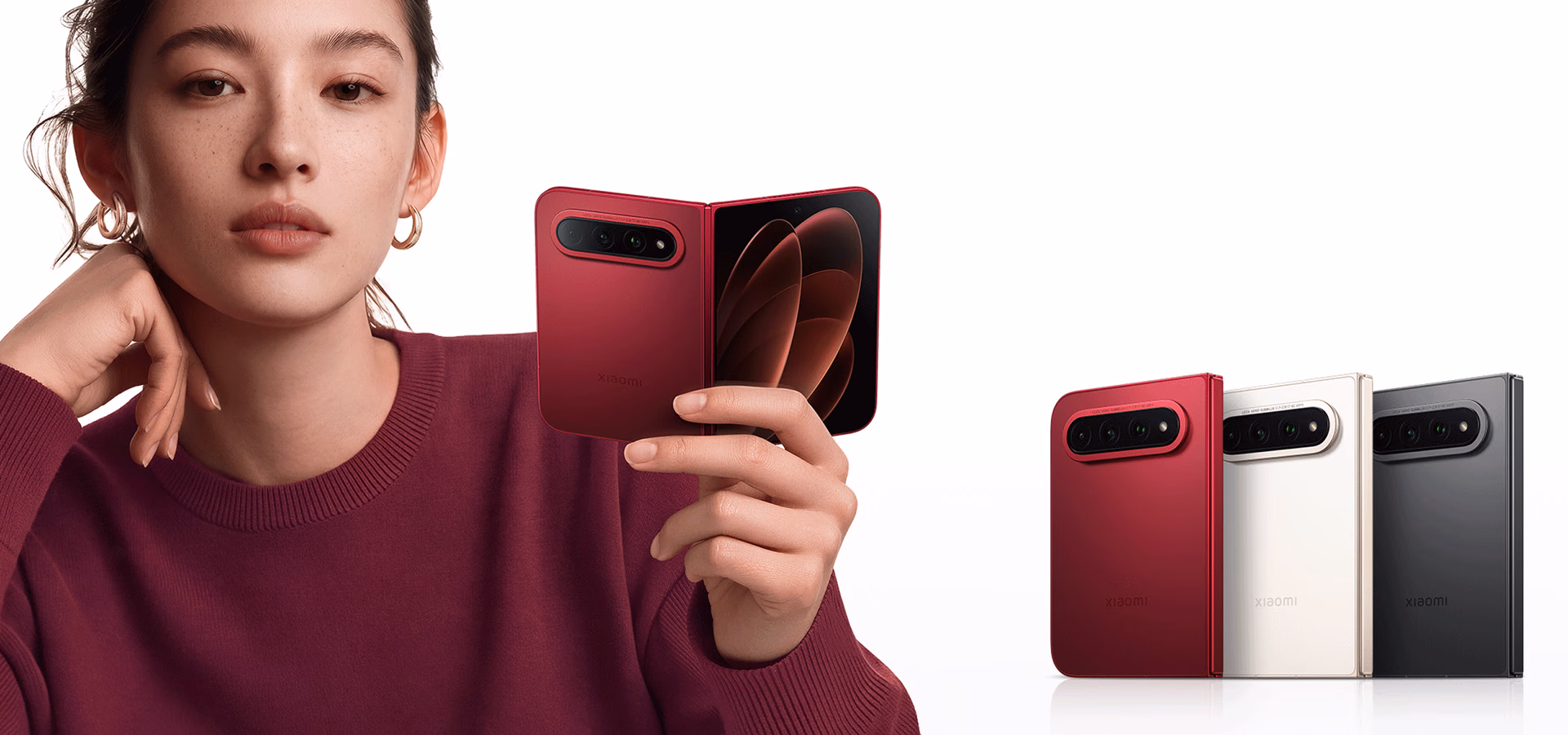 The red Xiaomi 18 Fold open in one hand, alongside the three aligned finishes